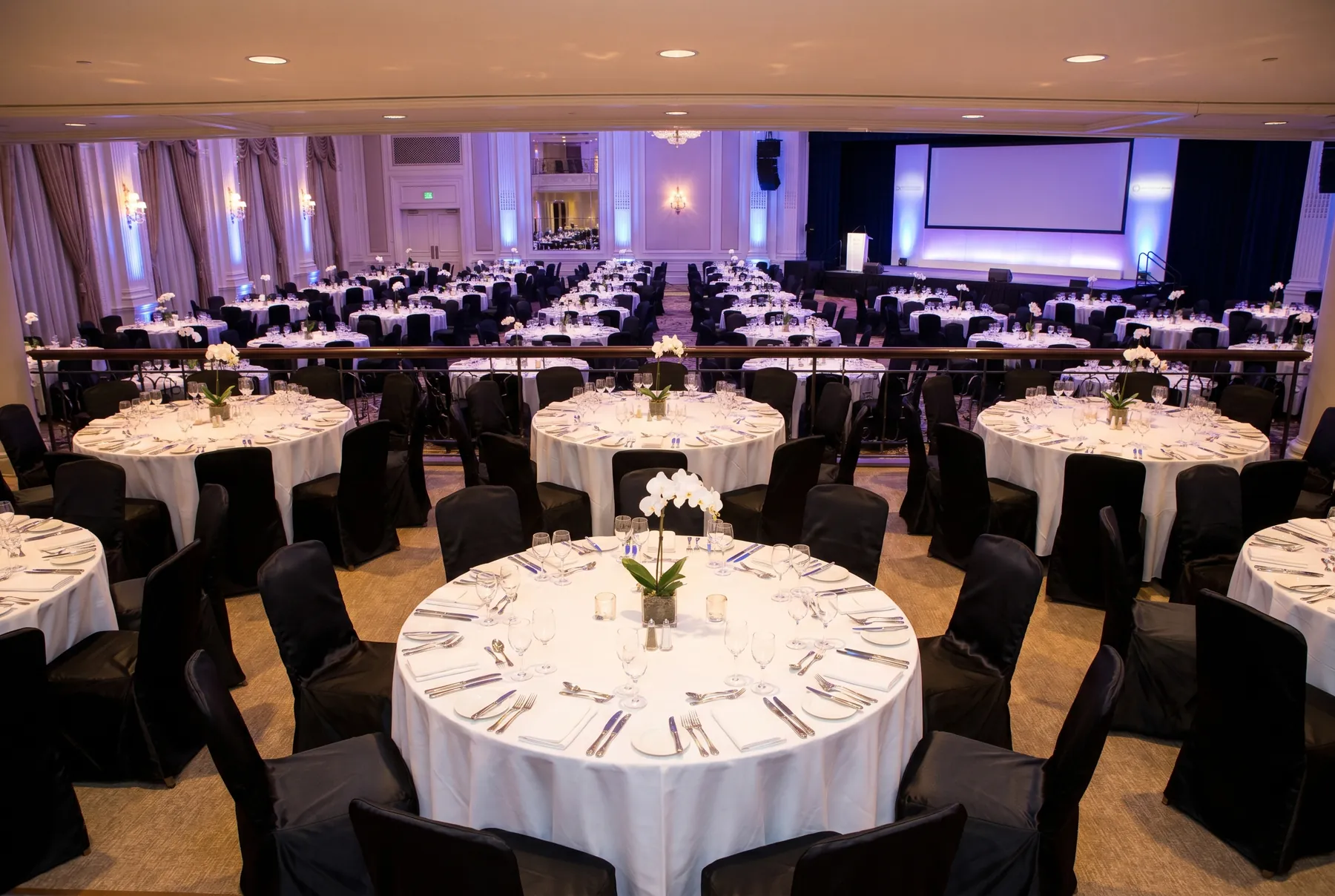 Corporate gala dinner with black chair covers
